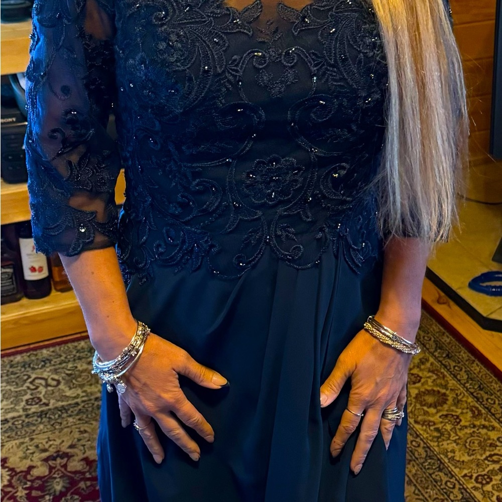 Worn once to my daughter’s wedding!! Beautiful beaded navy dress.